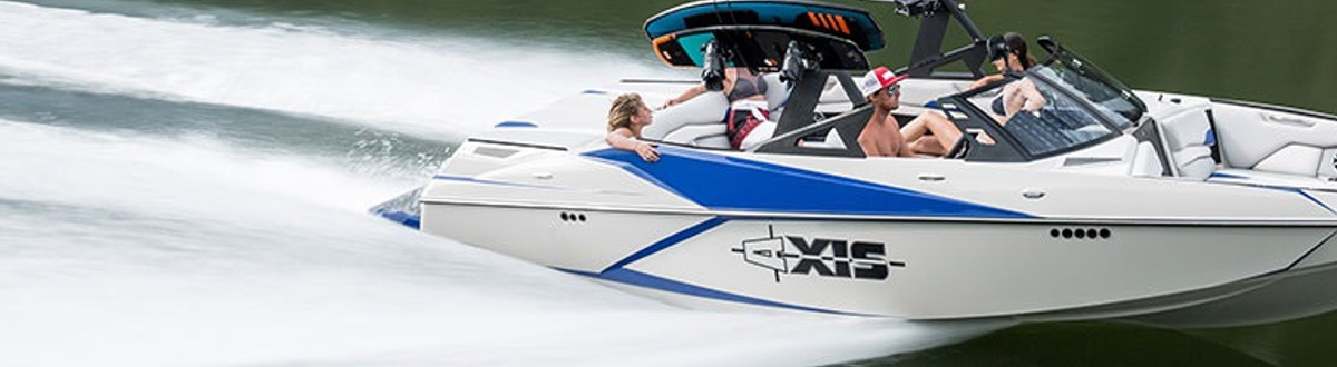 People on an Axis wake boat speeding down the water